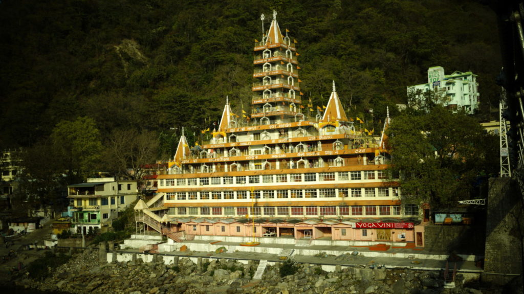 photography of shiva temple from laxman jhula in rishikesh