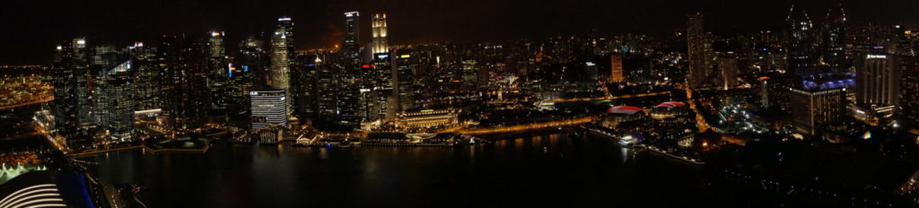 night photography of singapore city from marine bay sand