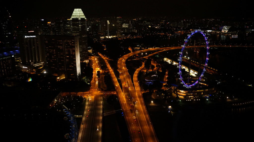 night photography of singapore city from marine bay sand