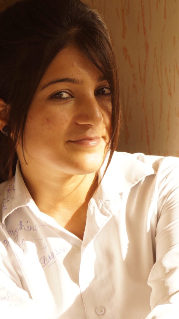 Vibrant image of a young woman with warm lighting, showcasing natural beauty and expressive eyes, ideal for beauty, fashion, or lifestyle photography. and it is also used in Portrait Photography Composition Techniques blog