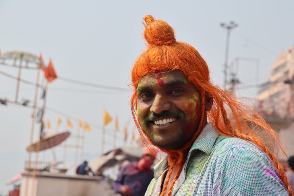 A man celebrating Holy with beautiful colors in Varanasi and dressed like lord Shiva And it is also used in Portrait Photography Composition Techniques blog