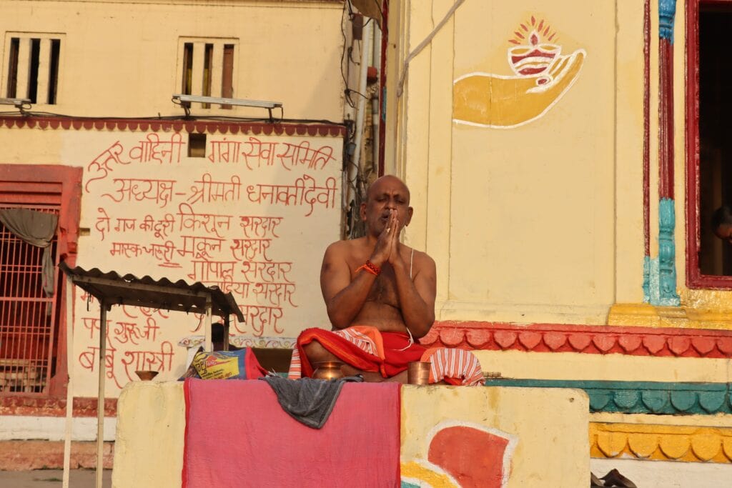 Candid photography of a man worshiping in varanasi