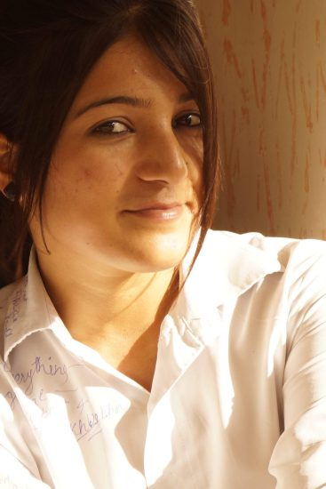 Vibrant image of a young woman with warm lighting, showcasing natural beauty and expressive eyes, ideal for beauty, fashion, or lifestyle photography. and it is also used in Portrait Photography Composition Techniques blog