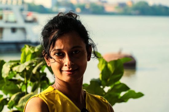 photography of a beautiful woman with side light which is one of the type of light and the place is princep ghat. And it is also used in Portrait Photography Composition Techniques blog